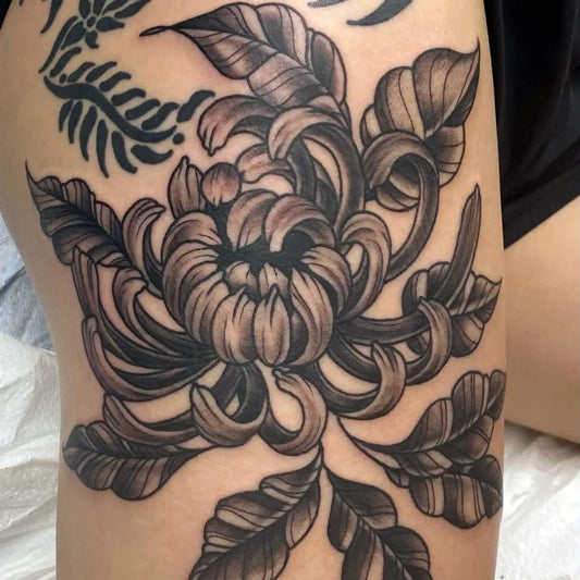 Flower tatoo on woman's arm