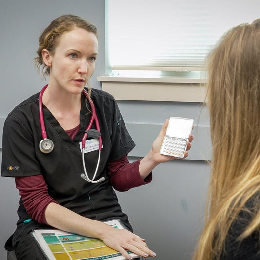 Doctor conferring with patient