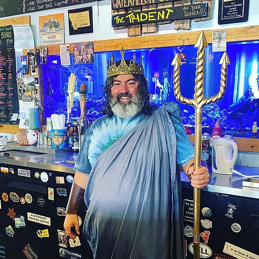 Man behind bar with Neptune's trident